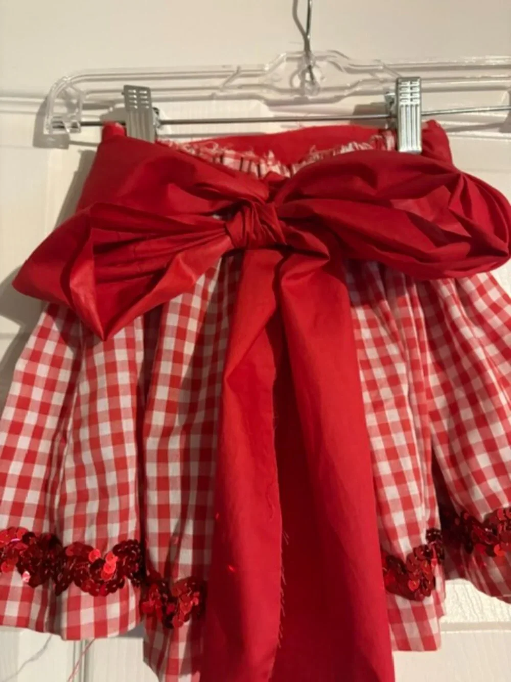 Eight Red Country Recital Skirts with Sashes